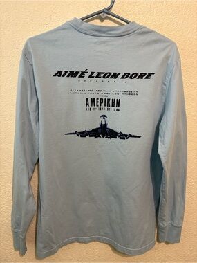 Aime Leon Dore Light Blue Long-Sleeve Shirt with Navy Graphic Plane Print